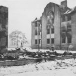 The ruins of the parish hall with the mixed school in the background in 1940.