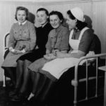 Lotta Svärd volunteers at the 17th Military Hospital in the School for the Deaf and Mute, and nurse S. Mattila.