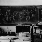 A classroom in the mixed school serving as an office. The images were drawn by Lieutenant Erkki Tilvis.